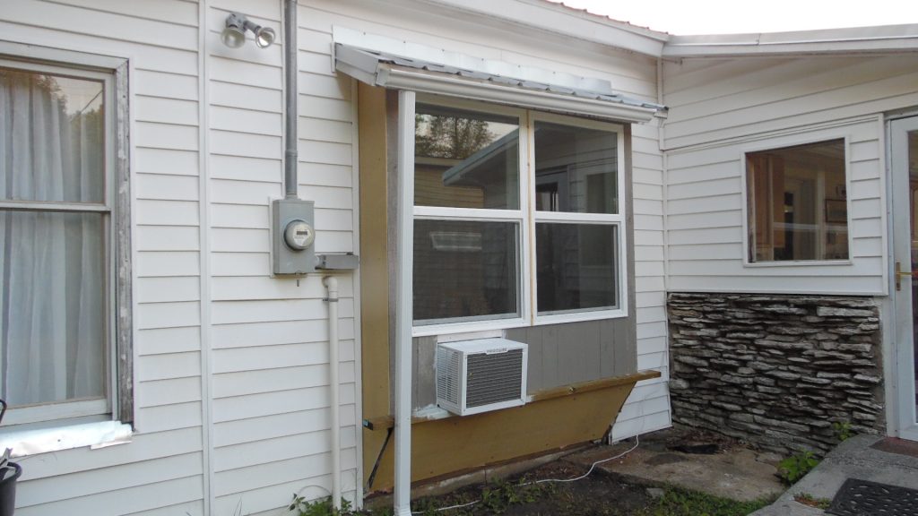 Completed repairs from the outside (more painting needed) Completed repairs from the outside (more painting needed)