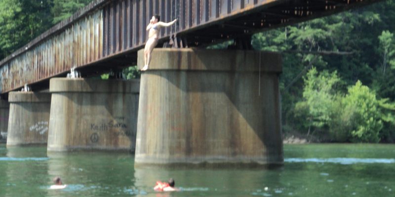 Anna jumps off the trestle