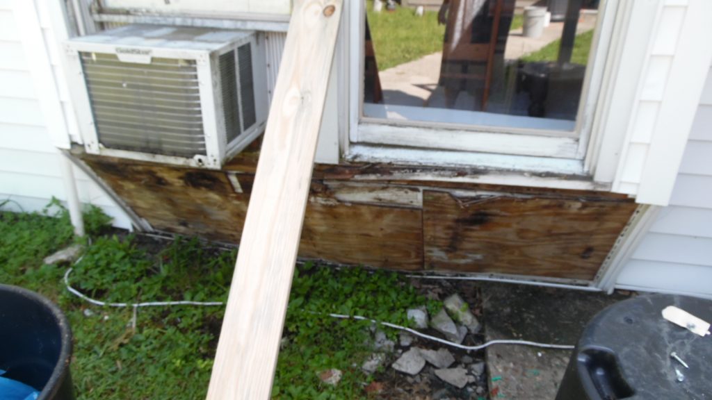 Rotted wood and old air conditioner. Rotted wood and old air conditioner.